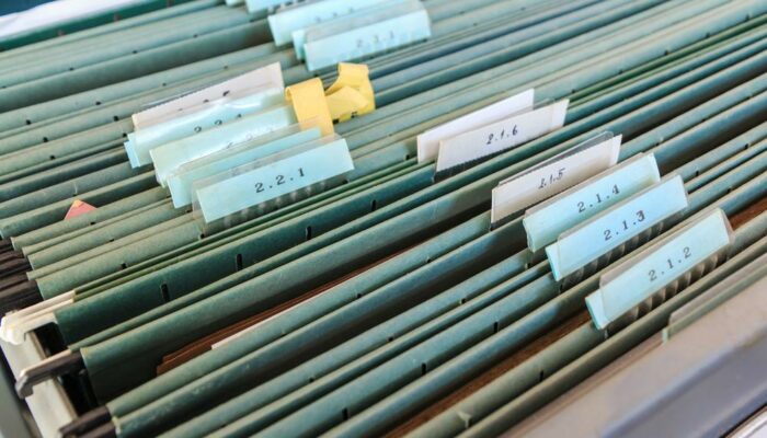 Organize files with filing cabinet