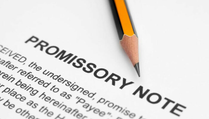 What should be included in a promissory note?